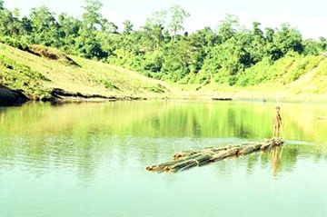 Boy floating bamboos2.jpg