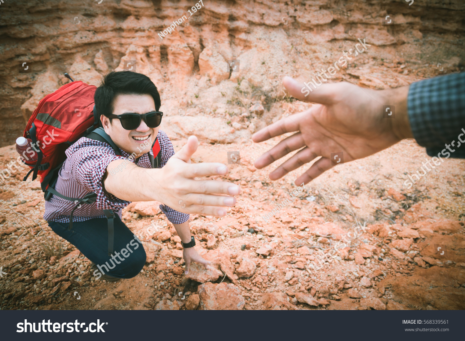 stock-photo-image-of-giving-hand-and-helping-to-climb-help-support-assistan.jpg