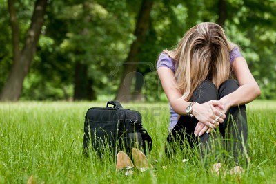 7201637-young-depressed-business-woman-siting-in-grass--notebook-bag-and-shoes-lying-next.jpg