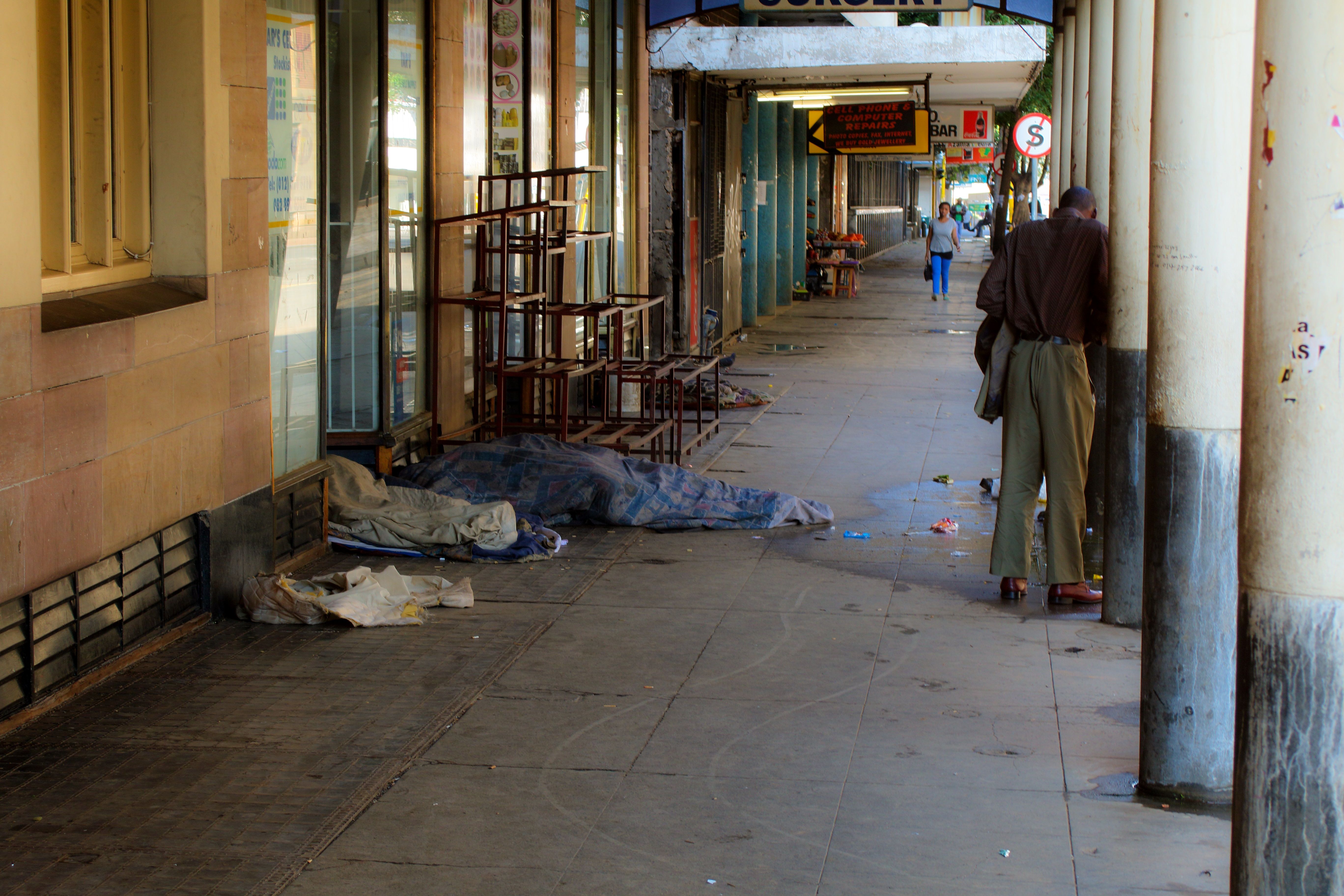 16 sleeping on sidewalk.jpg