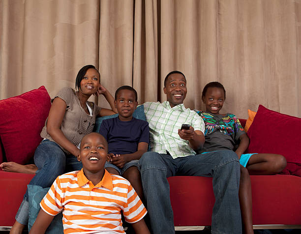 family-on-couch-watching-television-johannesburg-south-africa-picture-id114217622.jpeg