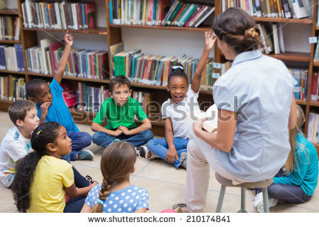 stock-photo-cute-pupils-and-teacher-having-class-in-library-at-the-elementary-school-210174841.jpg