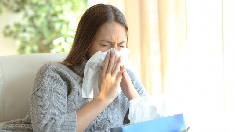 sick_woman_blowing_nose.jpg