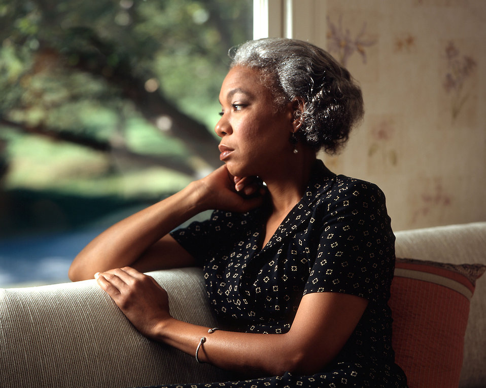 17073-an-african-american-woman-looking-out-a-window-pv.jpg