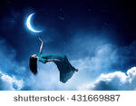 stock-photo-woman-in-night-sky-431669887.jpg