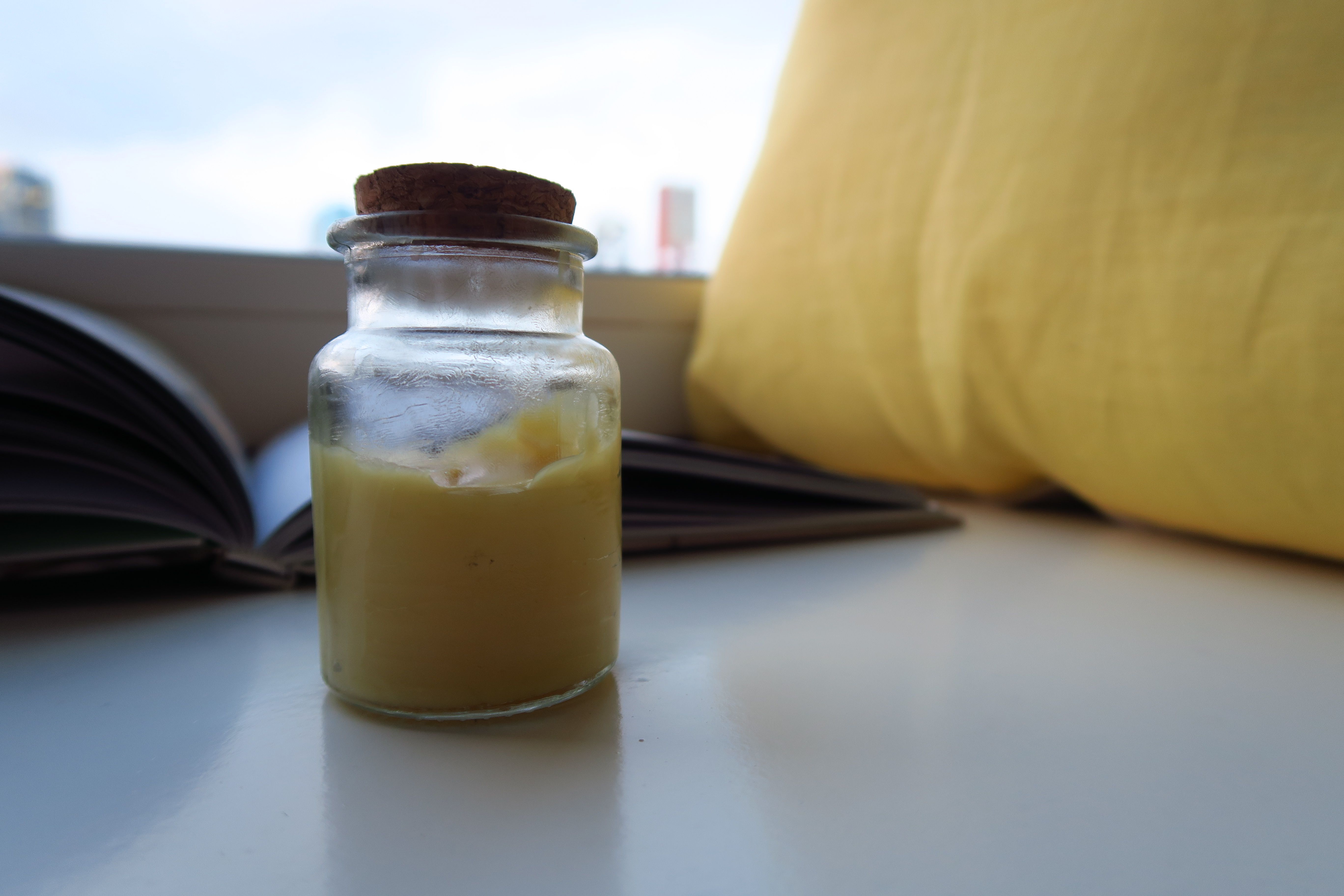 diy beauty product facial cream end result in tiny glass jar.JPG
