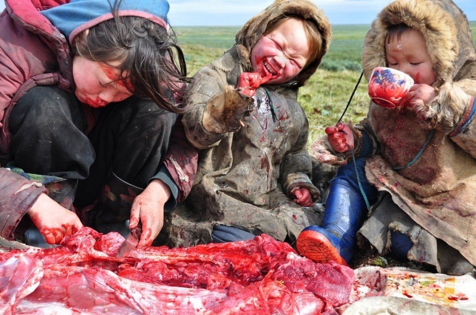 humans eating raw meat.jpg