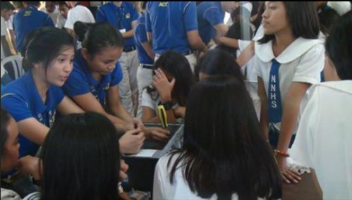 STEFANY WITH STUDENTS.png