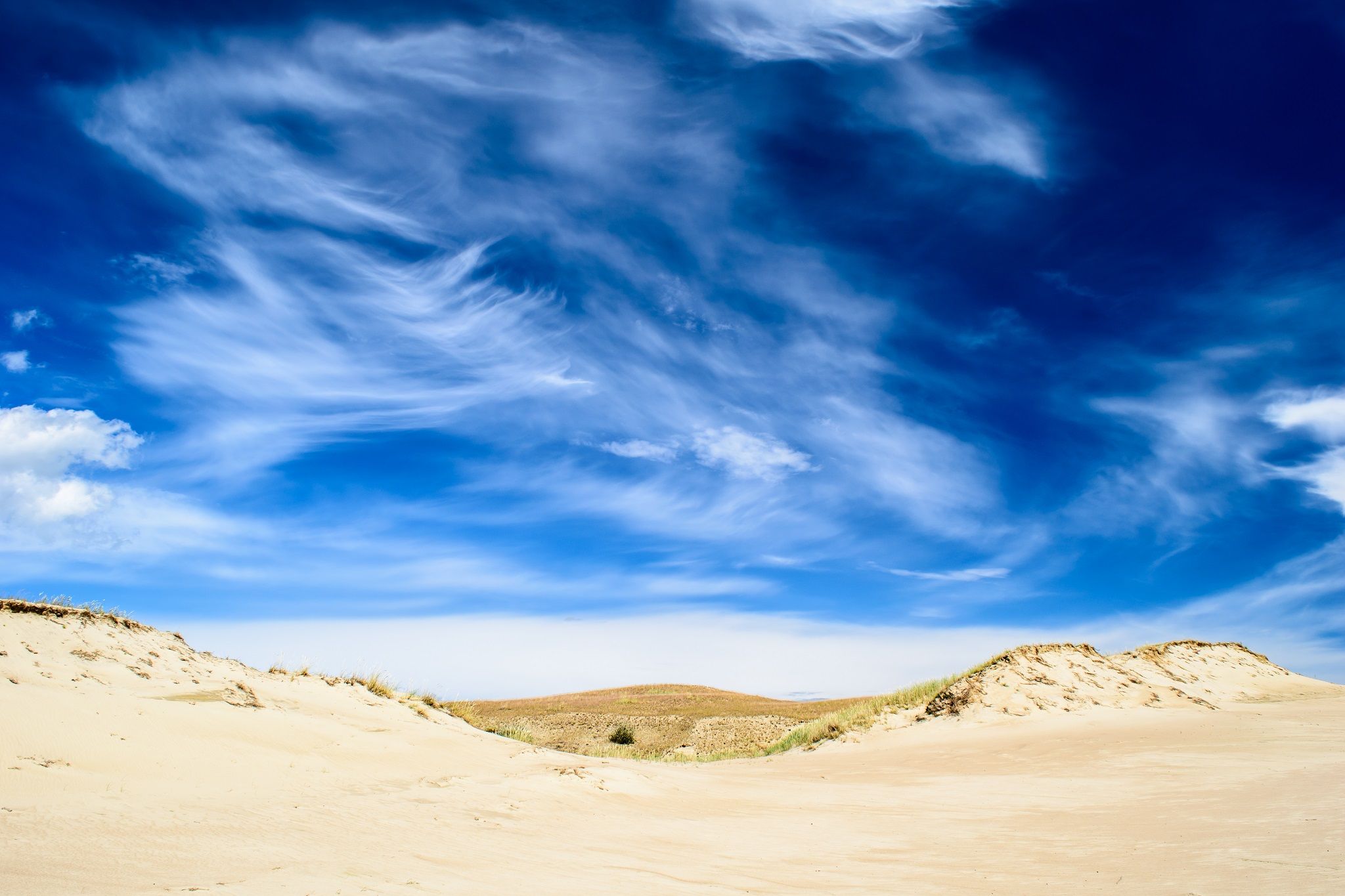 spectacular, cloudy, sky-over, sandy-ground web.jpg