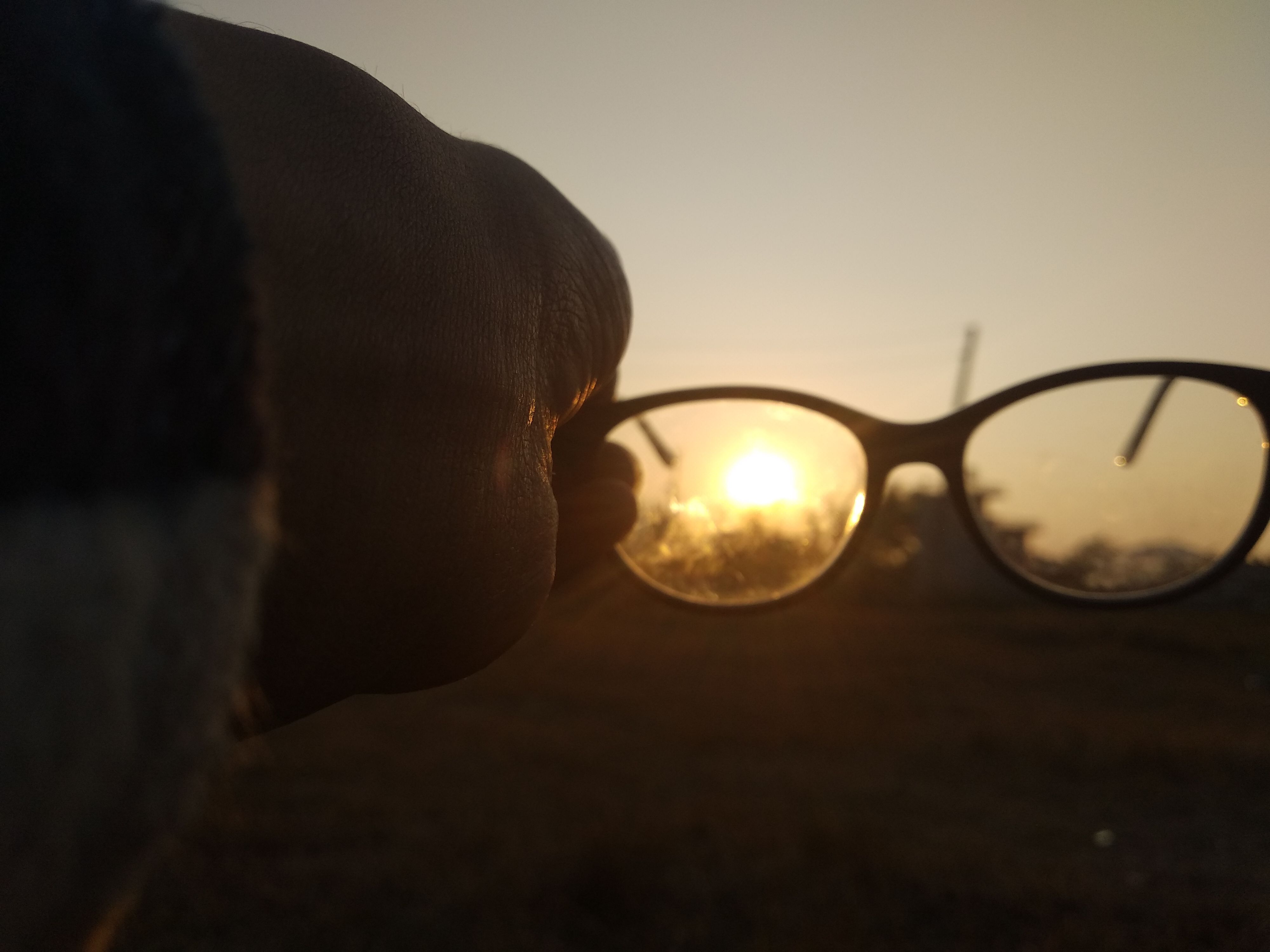 hiding behind sunglasses