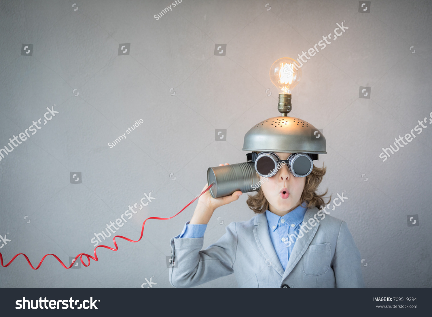 stock-photo-portrait-of-child-in-classroom-child-with-toy-virtual-reality-headset-in-class-funny-kid-with-709519294.jpg