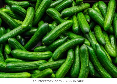 green-cucumbers-on-shelf-supermarket-260nw-286367408.jpg