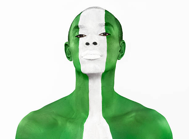 nigerian-flag-painted-on-mans-face-picture-id102768621.jpg