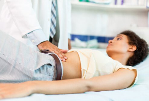 abdominal-pain-s3-photo-of-doctor-examining-woman.jpg
