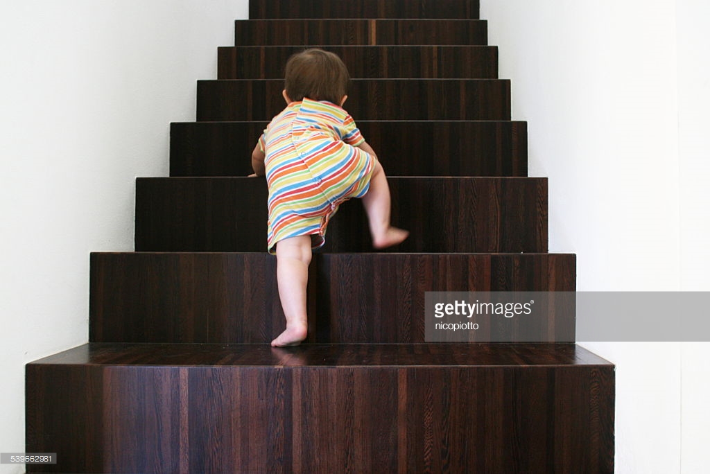 baby-climbing-wooden-stairs-picture-id539662981.jpg