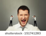 stock-photo-emotional-man-listening-his-inner-voice-over-grey-background-151741283.jpg