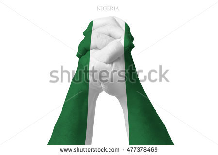 stock-photo-man-clasped-hands-patterned-with-the-nigeria-flag-477378469.jpg