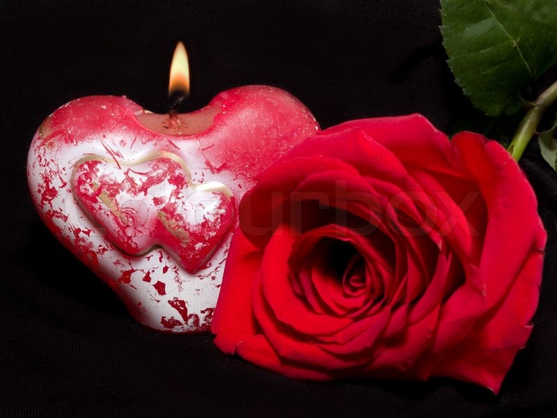 2547710-valentine-s-still-life-with-candle-in-shape-of-heart-and-red-rose-on-the-black-background-focus-on-the-candle-1.jpg