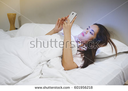 stock-photo-asian-woman-using-smart-phone-at-night-on-the-bed-blue-light-from-screen-harm-the-eyes-601956218.jpg