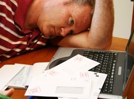 overwhelmed-man-at-computer-with-unpaid-bills-montage.jpg