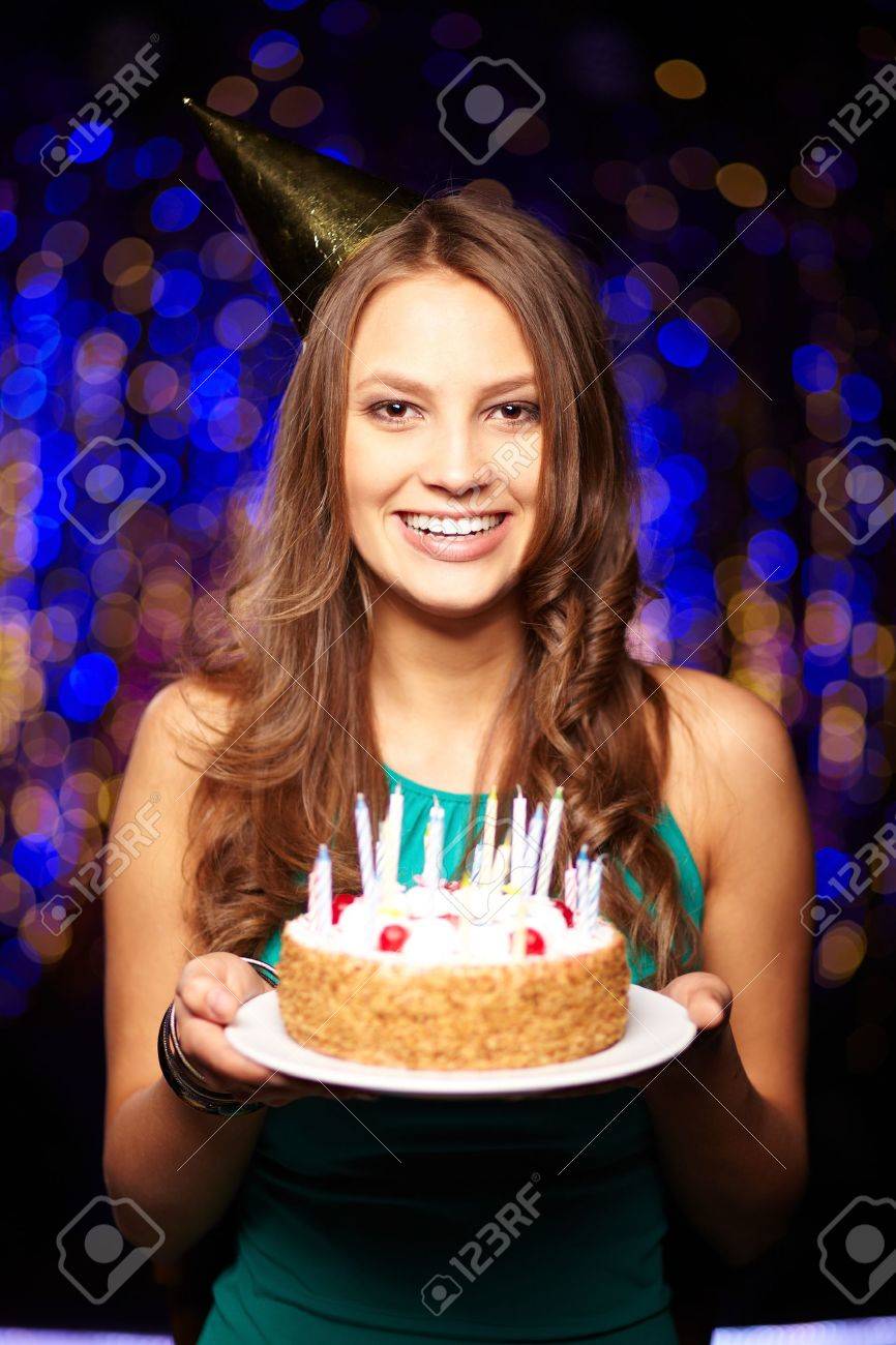 16333891-portrait-of-joyful-girl-holding-birthday-cake-with-candles-and-looking-at-camera-at-party.jpg
