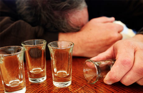 drunk-man-with-empty-shot-glasses460x300.jpg