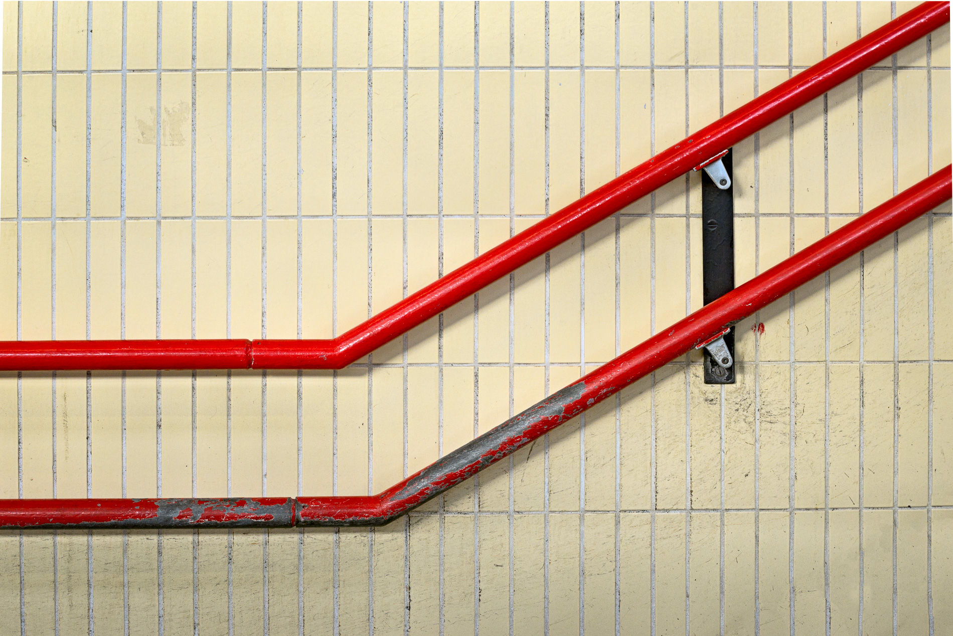 Red handrails of a public staircase