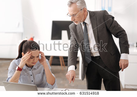 stock-photo-wicked-businessman-showing-at-workplace-of-his-worker-631514918.jpg