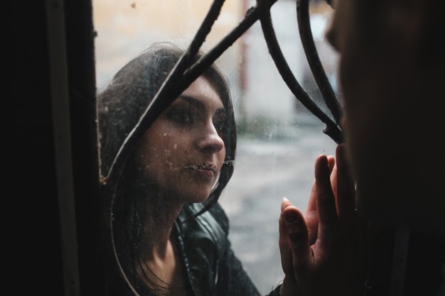 sad-woman-looking-at-her-boyfriend-through-a-glass_1153-1006.jpg