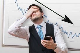 bad_investment_or_economic_crisis_concept_businessman_is_disapp_cg1p35145049c_th.jpg