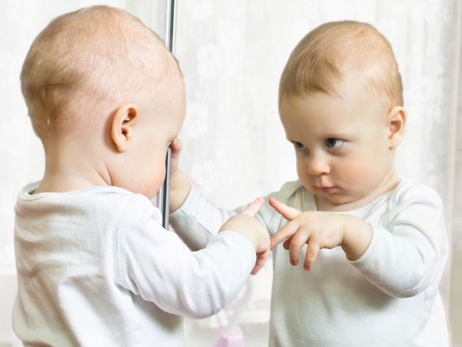 Baby-being-self-aware-looking-in-mirror.jpg