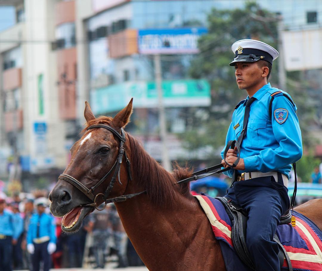 Striding high. A vigilant mounted Nepal Police personnel in Jawalakhel on the oc.jpg