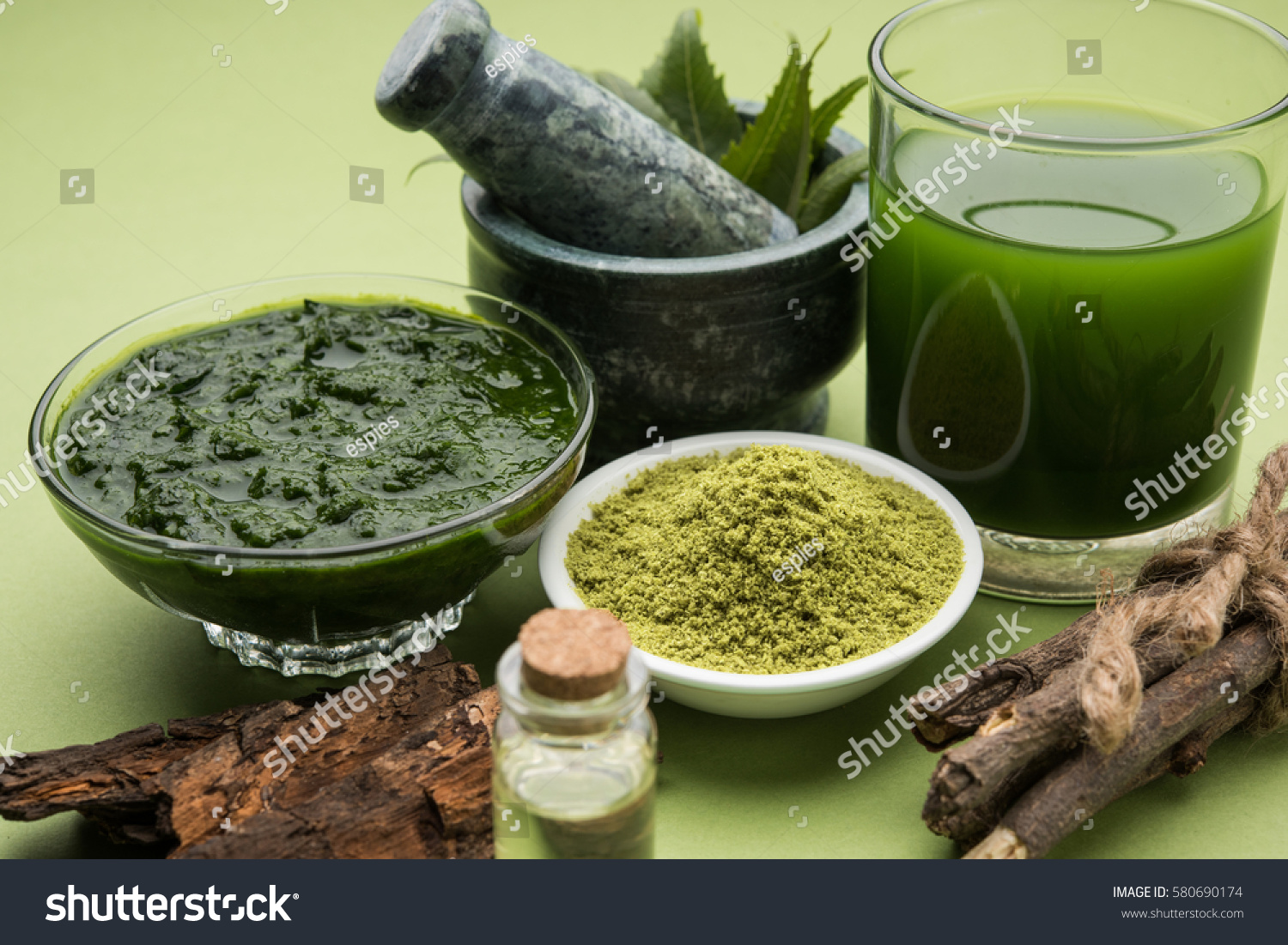 stock-photo-medicinal-ayurvedic-azadirachta-indica-or-neem-leaves-in-mortar-and-pestle-with-neem-paste-juice-580690174.jpg