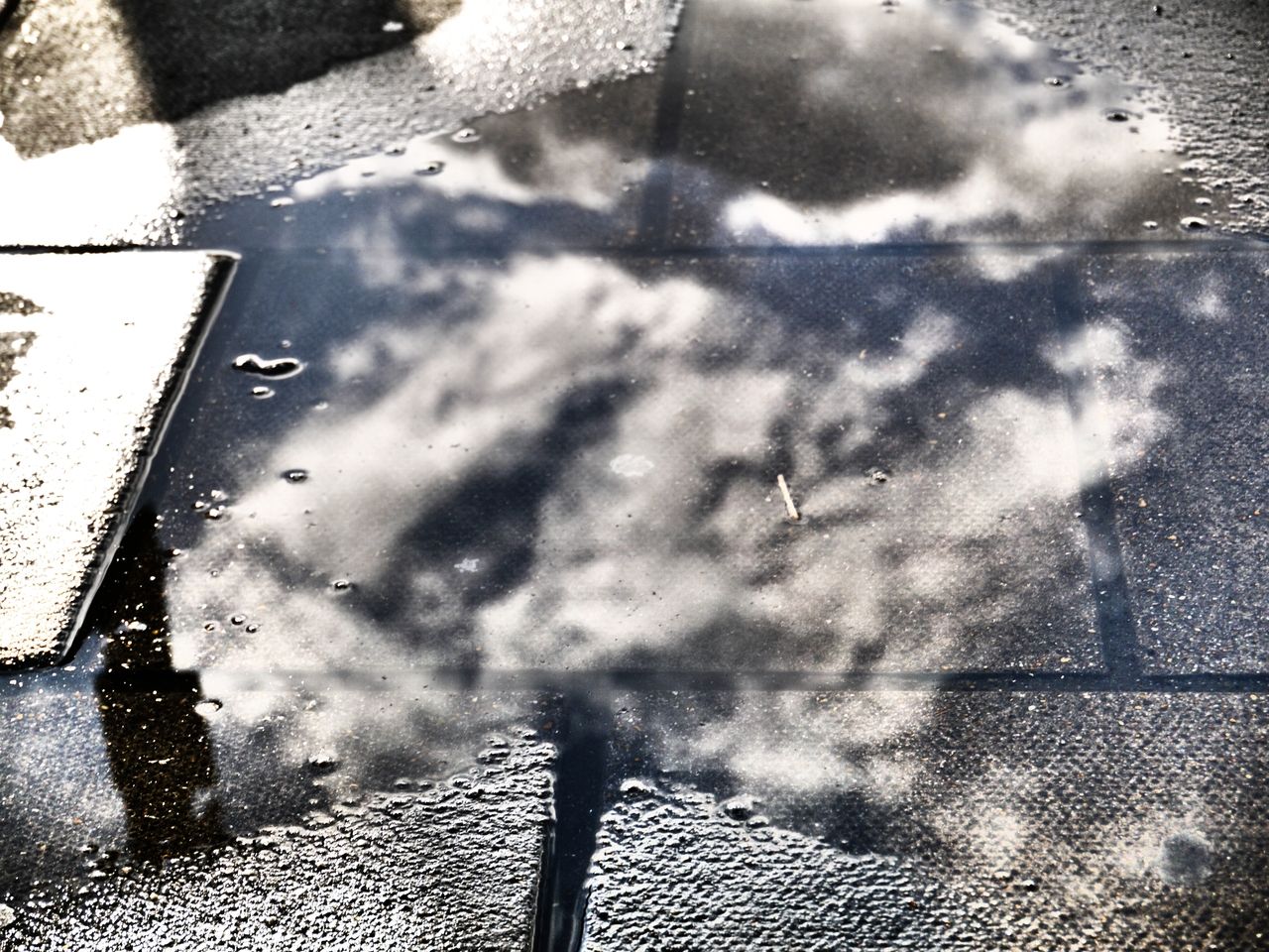 36743069768 - clouds rain puddle pavement.jpg