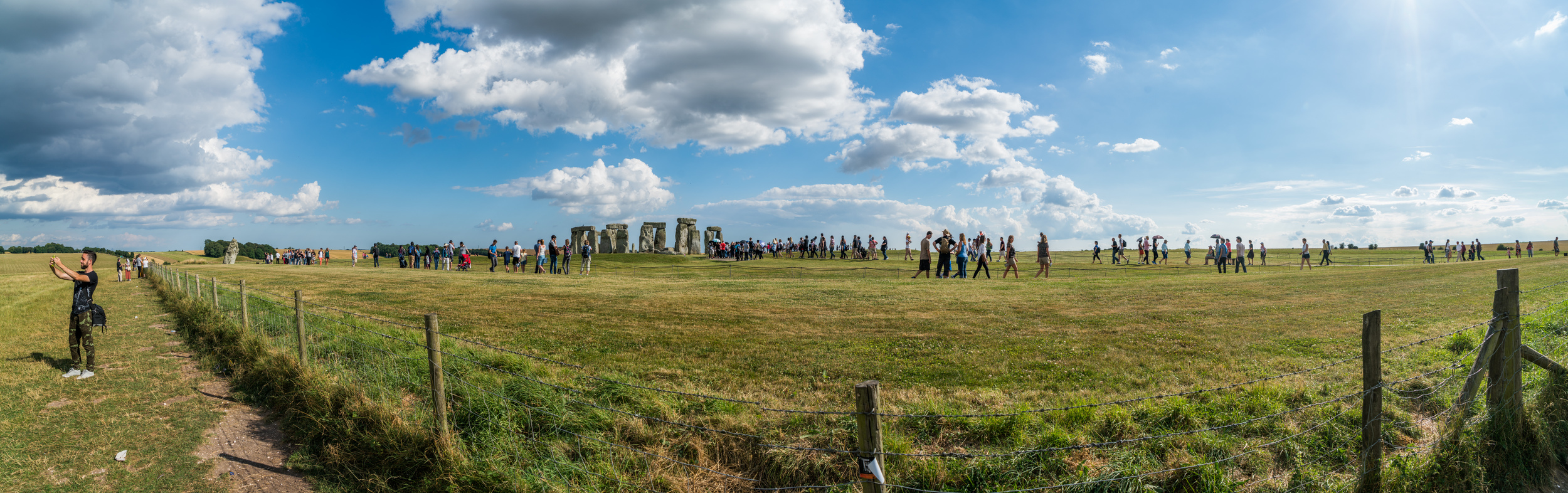 This is a very wide-angle panorama that shows the view from the farmer's field and the lay of the land. Where my brother Benji is taking a selfie on the left is where you can stand for free.