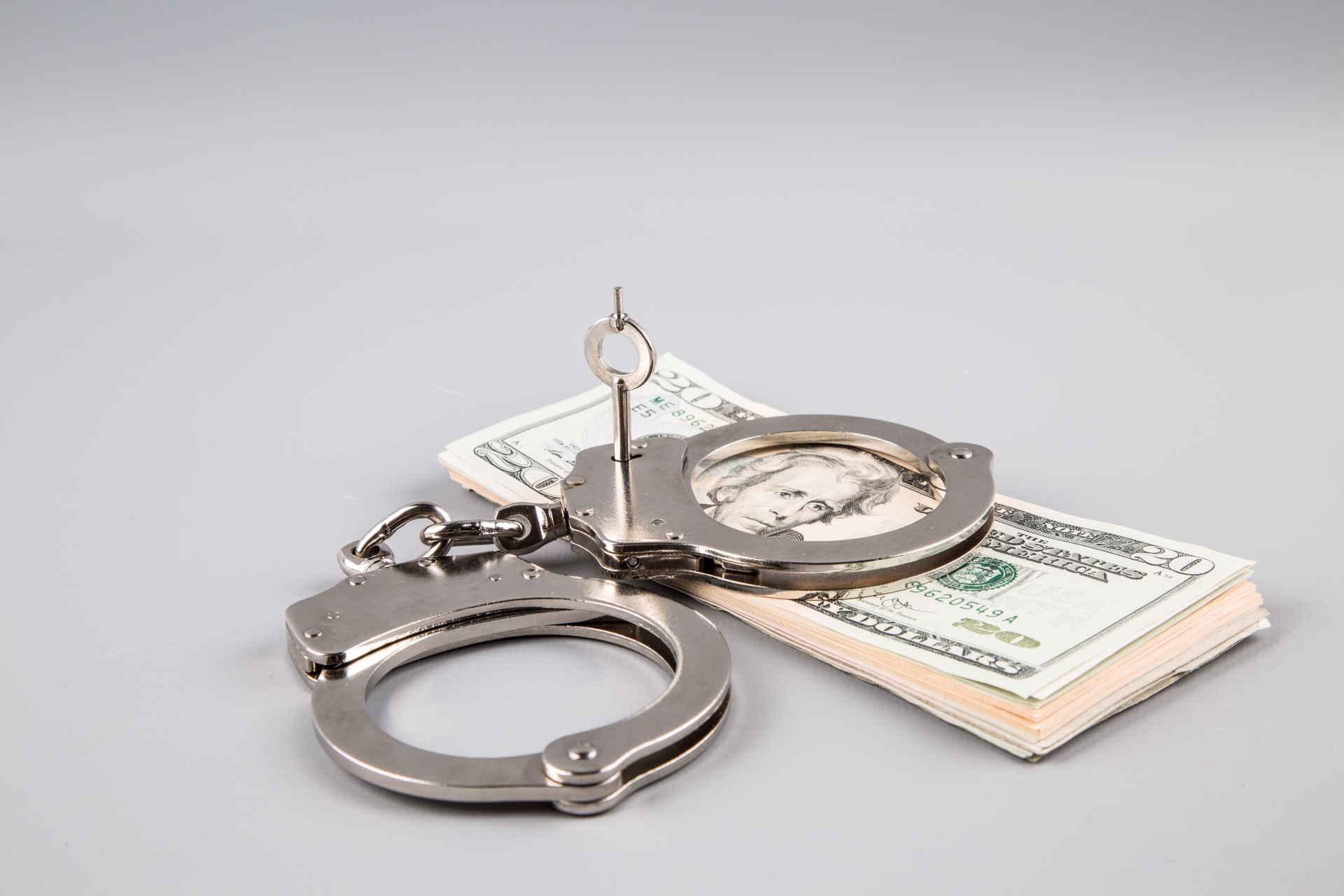 handcuffs-and-money.jpg