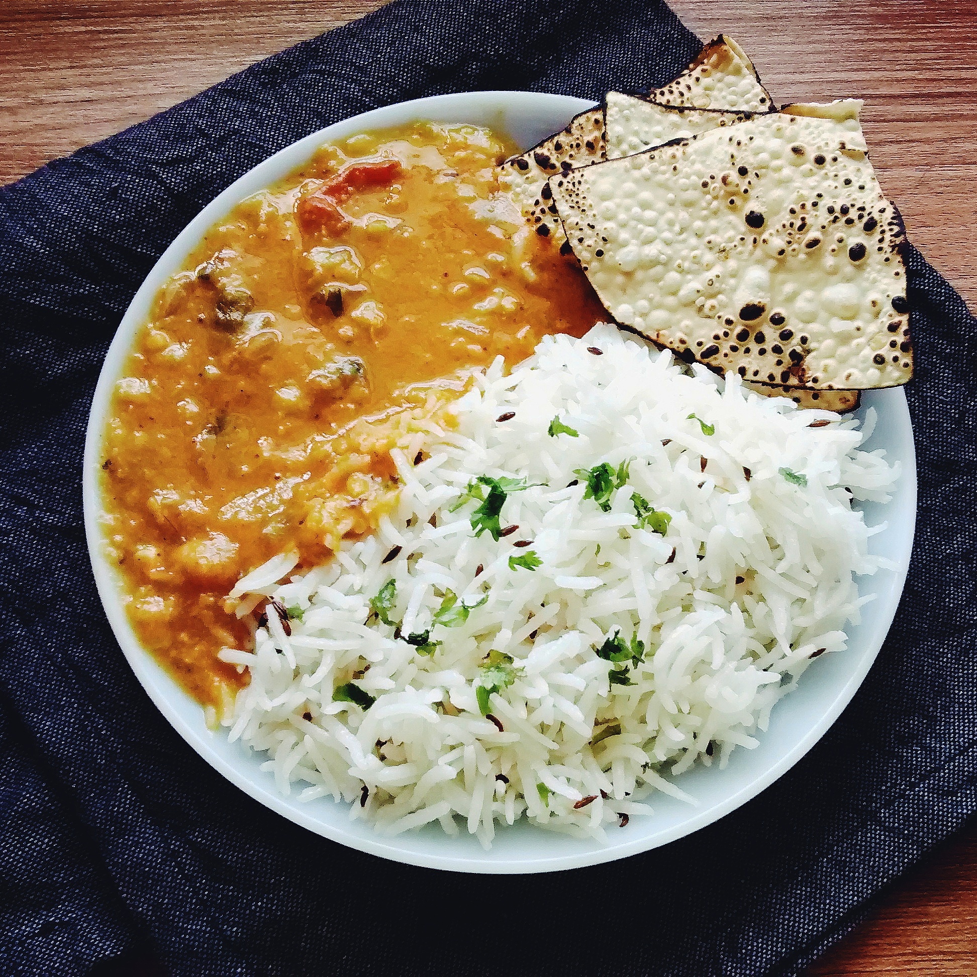 Dal_Fry_Tadka,_Cumin_Rice,_Roasted_Papad_on_the_side.jpg