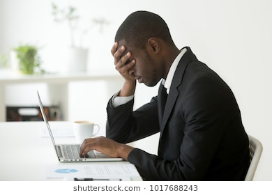 tired-depressed-black-businessman-workplace-260nw-1017688243.jpg