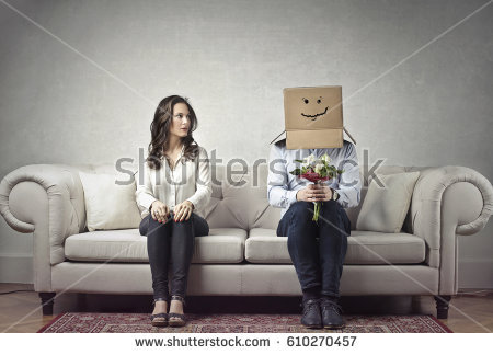 stock-photo-shy-man-sitting-next-to-a-woman-with-his-head-covered-by-a-cardboard-box-610270457.jpg