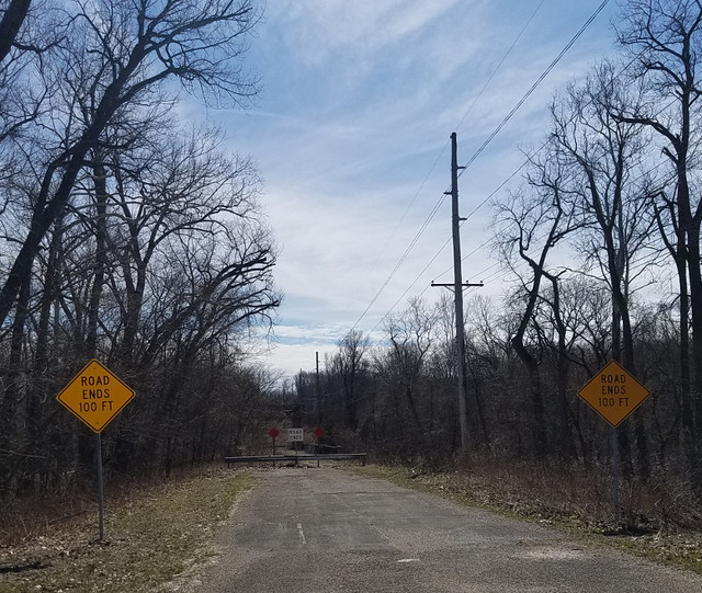 Approaching the bridge with 'road ends' signs