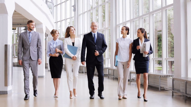 people-work-and-corporate-concept-business-team-with-folders-walking-along-office-building-and-talking_rhiwxwmy__F0000.png